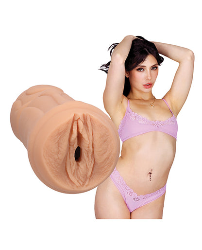 Jane Wilde in lingerie stares into the camera. The Signature Strokers - Jane Wilde stroker is shown next to the person's body. | Kinkly Shop