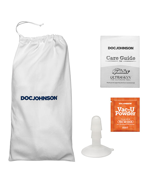 Everything included with the Signature Cocks - Chad White dildo. There's the storage bag, the care guide for the dildo, a sample of the Ultraskyn powder, and the Vac-U-Lock attachment suction cup. | Kinkly Shop