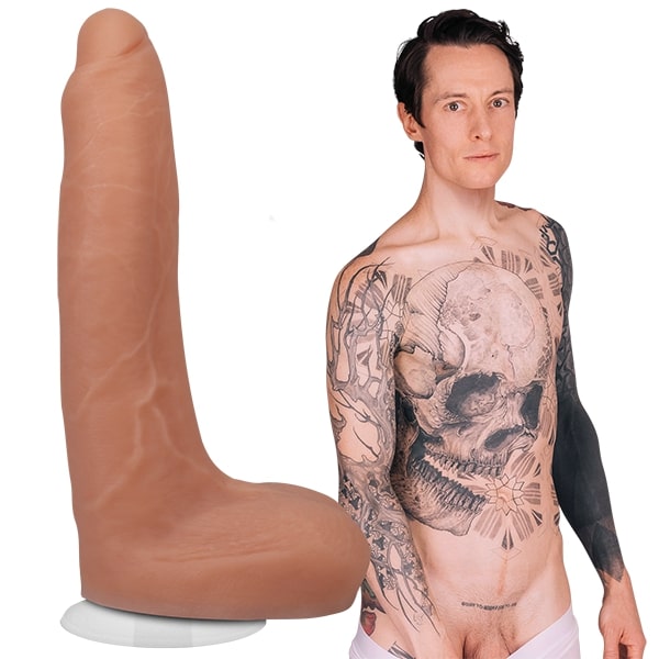 A shirtless Owen Gray is staring into the camera, pulling down their underwear. The Signature Cocks - Owen Gray Silicone dildo is shown next to porn star. | Kinkly Shop