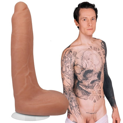 A shirtless Owen Gray is staring into the camera, pulling down their underwear. The Signature Cocks - Owen Gray Silicone dildo is shown next to porn star. | Kinkly Shop
