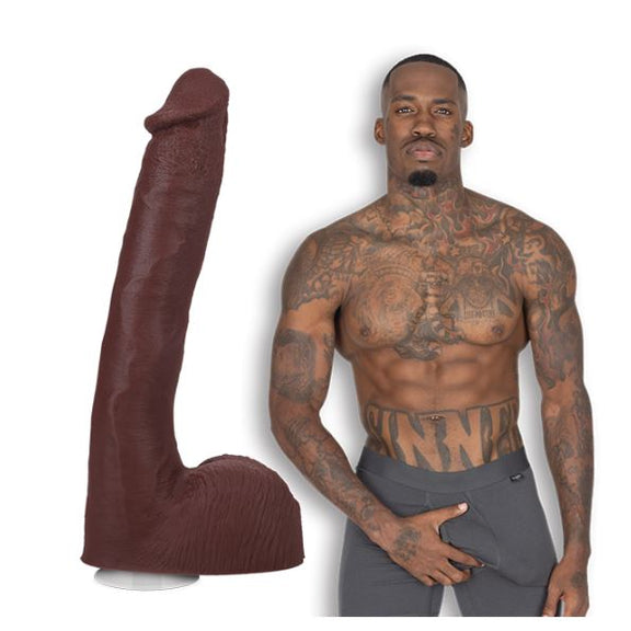 Pressure the porn star is shirtless and staring at the camera. He's wearing boxer briefs. The Signature Cocks - Pressure dildo is shown right next to Pressure. | Kinkly Shop