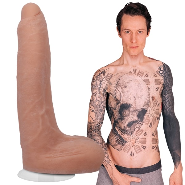 A shirtless Owen Gray in their boxer briefs. The Signature Cocks - Owen Gray dildo is shown next to Owen Gray, showcasing the lifecast dildo. | Kinkly Shop