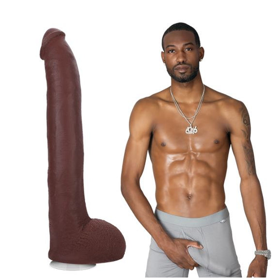 A shirtless Hollywood Cash stands while looking at the camera, grabbing a bulge in his boxer briefs. The Signature Cocks - Hollywood Cash dildo is shown next to him. | Kinkly Shop