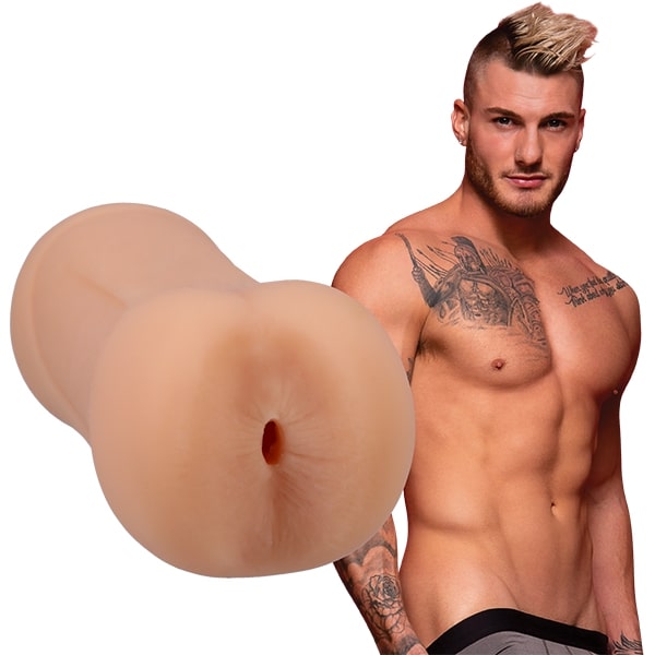 William Seed is shirtless and staring into the camera. The Signature Strokers William Seed stroker is shown next to the porn star. | Kinkly Shop