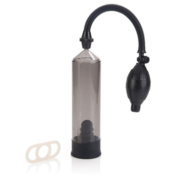 Optimum Series Precision Pump in front of a plain white background, showing the stretchy cock ring next to the pump. | Kinkly Shop