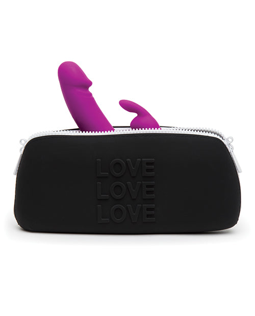 A rabbit vibrator sticks out the top of the Love Medium Silicone Storage Bag from between the zippers. The bag looks large enough to easily fit this full-sized rabbit vibrator in it. | Kinkly Shop