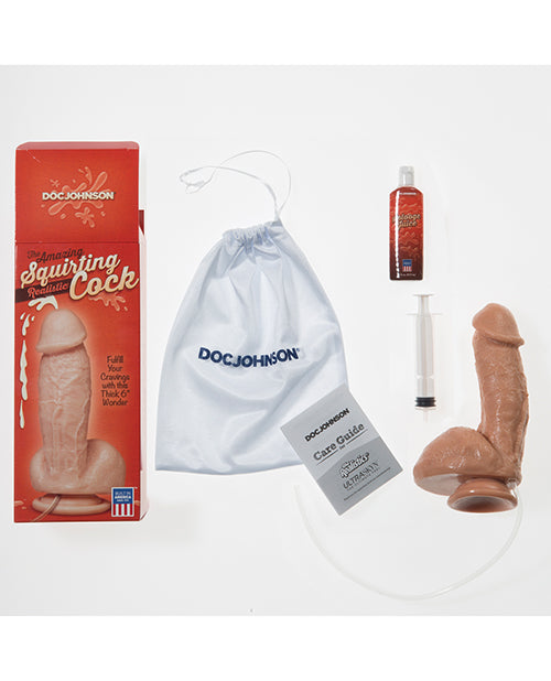 Everything that comes with the Doc Johnson Squirting Realistic Cock. There's the dildo itself, the plunger, the cording, the sample of cum lube, the care guide, and the white drawstring bag. | Kinkly Shop