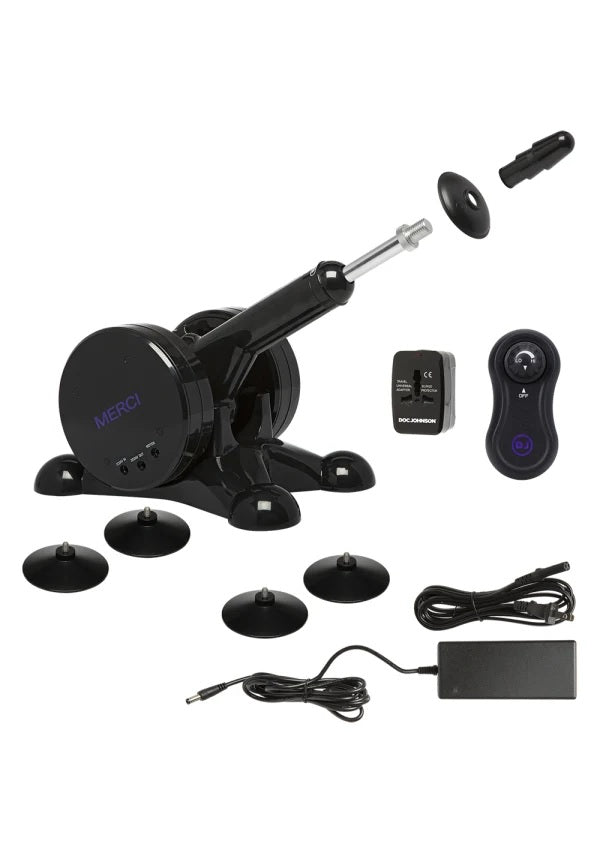 Everything included with the Merci Fuck Machine. It includes the non-slip feet, the power cable, the wireless remote, the power converter, and the screw-on dildo tip. | Kinkly shop
