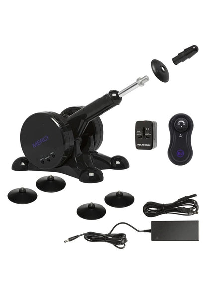 Everything included with the Merci Fuck Machine. It includes the non-slip feet, the power cable, the wireless remote, the power converter, and the screw-on dildo tip. | Kinkly shop