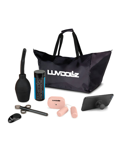 All of the accessories that come with the Luvdollz Remote Control Doggy Style Pussy & Ass. It includes a cleaning douche, renewal powder, a lube shooter, a wireless remote, two bullet vibrators, a phone stand, and a nylon ballistic storage bag. | Kinkly Shop