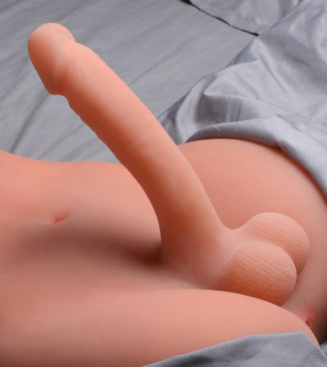 Close-up of the shaft protruding from the Transgender Terri Love Doll. It's really long and firm and holds its shape away from the sex doll. | Kinkly Shop