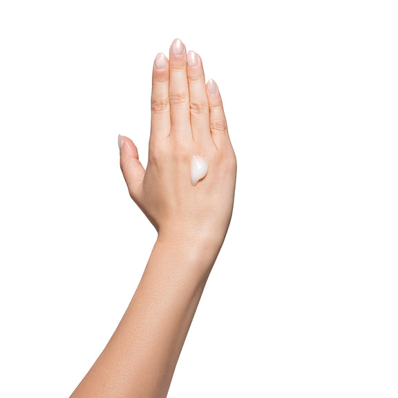 A dollop of the Dame Vaginal Balm Moisturizer placed onto a hand that's held vertical. It is not dripping despite gravity pulling down on the dollop. | Kinkly Shop