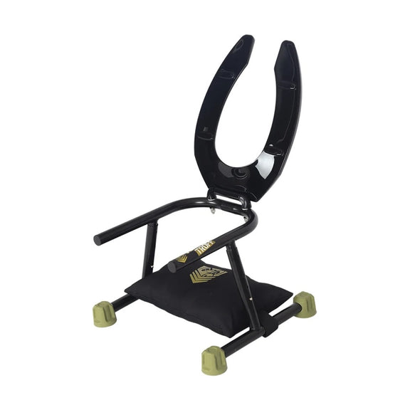 The Fort Troff Trench Rider set up with the included pillow while the toilet seat seat is lifted up, showcasing the metal frame underneath it | Kinkly Shop