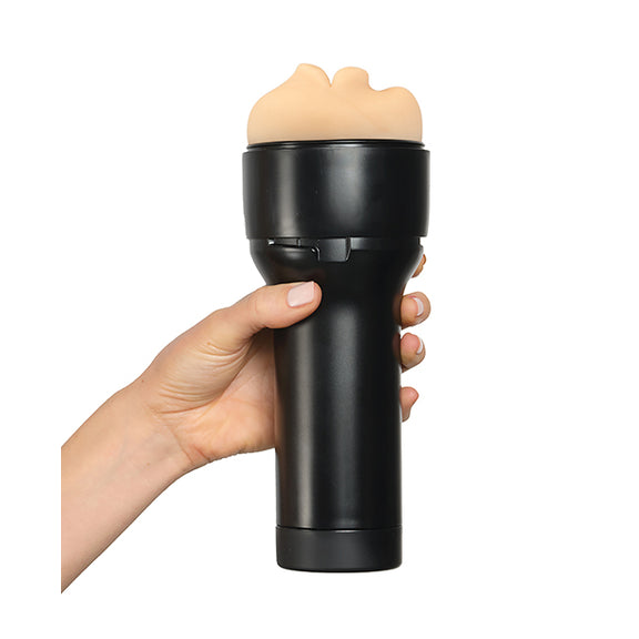 A hand holds the handle on the black case of the Kiiroo RealFeel Generic Mouth. The stroker looks comfortable and easy to hold in the hand. | Kinkly Shop