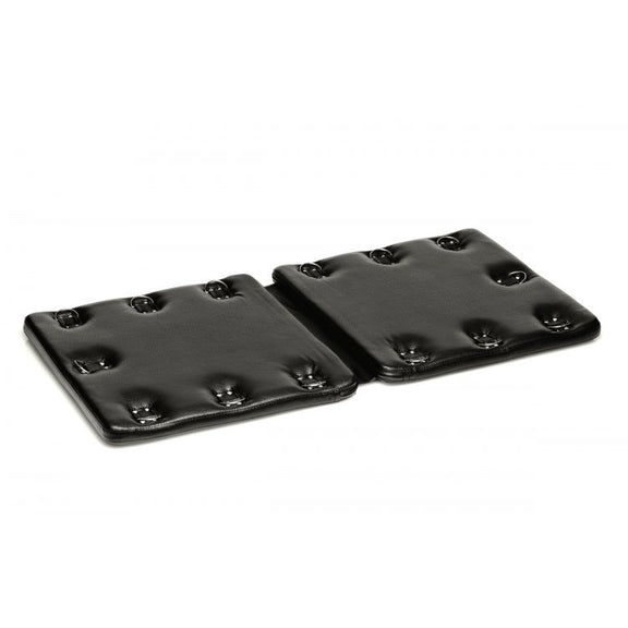 The Strict Bondage Board resting in front of a plain white background. It looks like two sturdy squares attached together by a flexible material that allows the two squares to fold together for storage. | Kinkly Shop