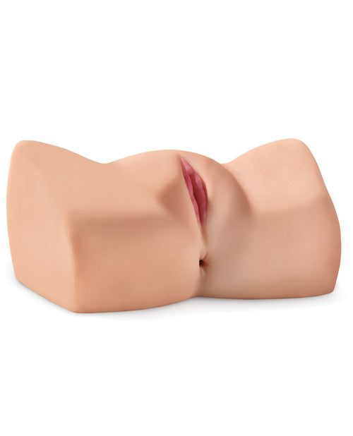 Pipedream Products Dirty Talk Interactive Bad Girl stroker shown laying on a flat surface. The stroker has two entrances - one vaginal entrance and one anal entrance. | Kinkly Shop