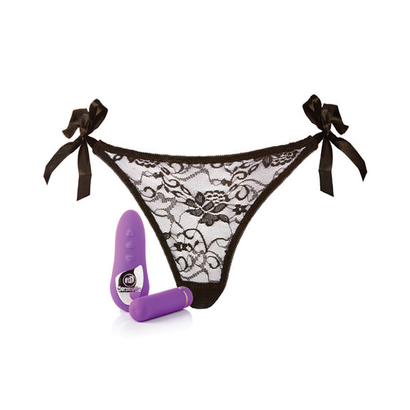 Everything included in the Pleasure Panty Bullet with Remote set. There's the oval-shaped, handheld remote control with its three buttons, the cylindrically-shaped bullet vibrator, and the included panty. On each of the hips of the panty is a ribbon tie that allows you to fully adjust how tight the panty fits. | Kinkly Shop