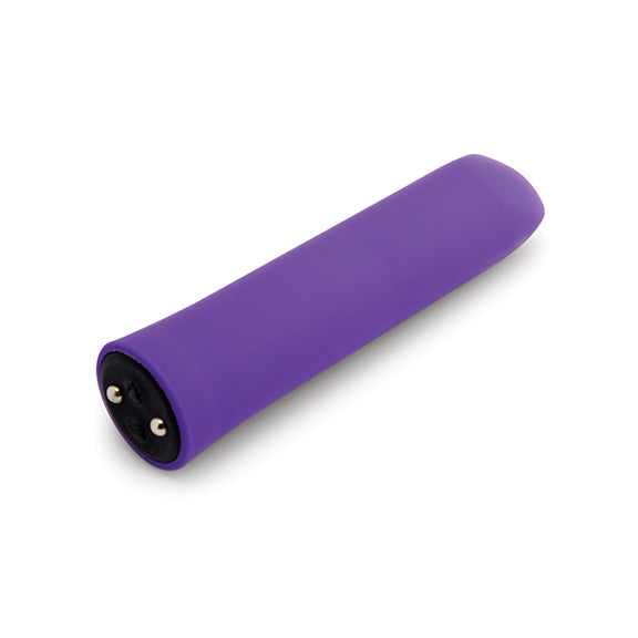 The Nubii: Sunni Warming Bullet laying on its side, showcasing the buttons on the base that rest right next to magnetic charging ports where the charger attaches. | Kinkly Shop
