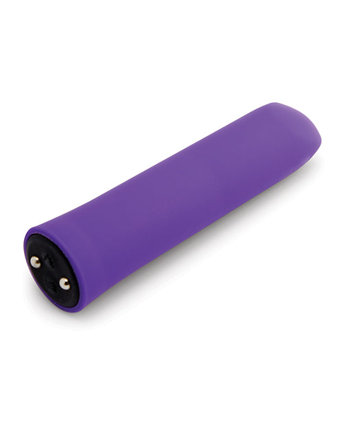 The Nubii: Sunni Warming Bullet laying on its side, showcasing the buttons on the base that rest right next to magnetic charging ports where the charger attaches. | Kinkly Shop