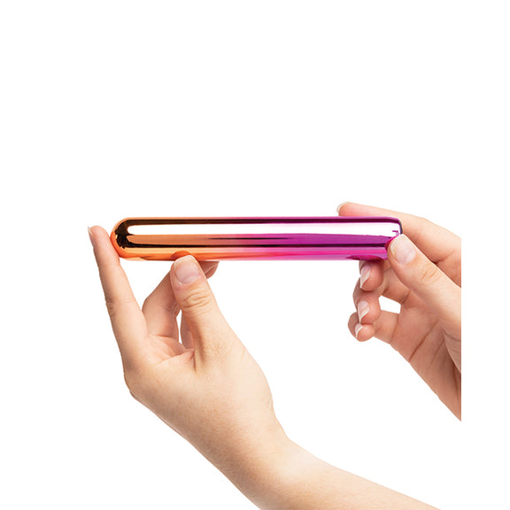 Two hands hold the slender vibrator of the Aluminum Rumba. It is narrower than two fingers' width, but it's much longer than a single finger. | Kinkly Shop