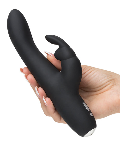 The Greedy Girl Rechargeable Slimline is being held in someone's hand. The shaft looks surprisingly slender compared to most rabbit vibrators. The base of the vibrator has a rounded base. | Kinkly Shop