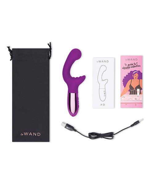 Everything that's included with the Le Wand XO. It includes the vibrator, the instruction booklet, a promotional booklet, a drawstring black bag, and charging cable. | Kinkly Shop