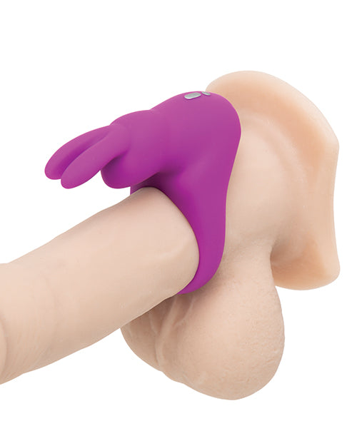 The Happy Rabbit Rechargeable Cock Ring wrapped around the base of a dildo. It looks like a snug, but not painfully tight, fit. | Kinkly Shop