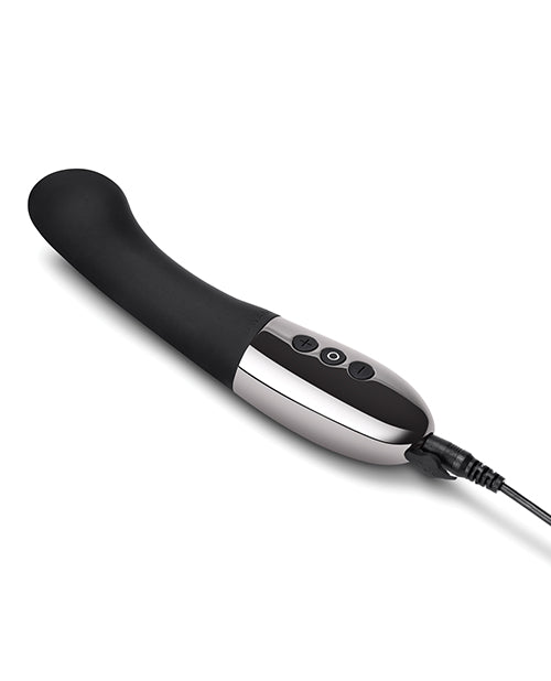 The Le Wand Gee vibrator in black plugged into the charging cable. There's a charging cable port door open at the base of the vibrator | Kinkly Shop