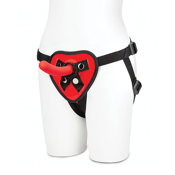 A mannequin wears the Lux Fetish Red Heart Strap-On Set hip harness around the hips with the dildo in the O-ring. | Kinkly Shop