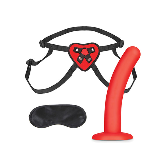 Everything included with the Lux Fetish Red Heart Strap-On Set. It includes the strap-on harness, the red dildo, and an elastic blindfold. | Kinkly Shop