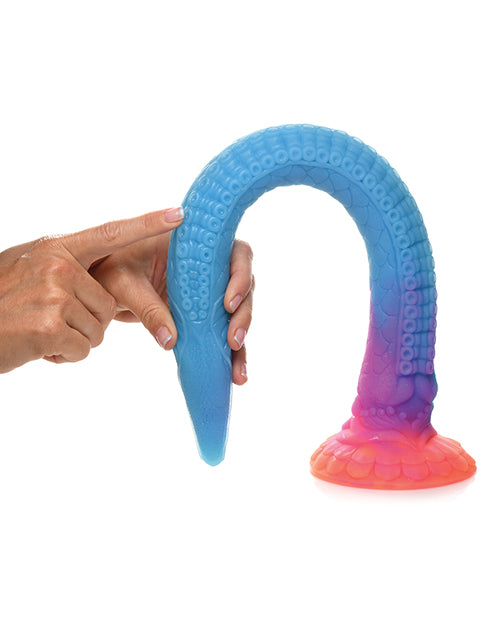 The Creature Cocks Makara bent in half, showcasing how bendable the dildo is. It looks like it can bend almost entirely in half. | Kinkly Shop