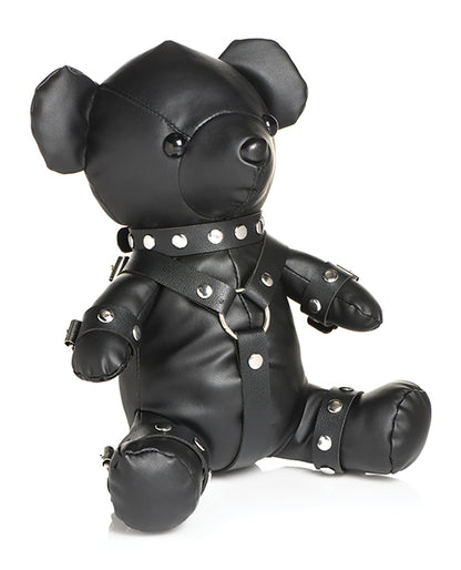 Side view of the Master Series Gimp Bear. The bear is wearing a collar, wrist cuffs, ankle cuffs, and a chest harness. | Kinkly Shop