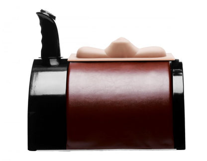 Side view of the The Saddle Deluxe Sex Machine showcases how the remote can be temporarily stored on top of the sex machine for a "saddle" appearance while the non-penetrative attachment is on top of the The Saddle Deluxe sex machine. | Kinkly Shop