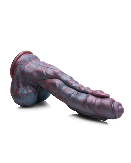 The Creature Cocks Hydra laying flat on a surface. The dildo is holding its own shape, showcasing the firm inner core that makes it hold its shape. | Kinkly Shop