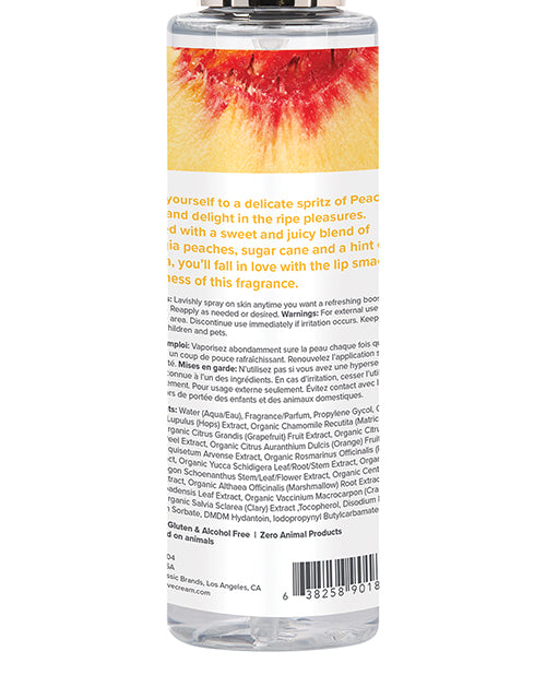 Close-up of the backside of the Coochy Fragrance Mist bottle. It has a lot of small text on it. | Kinkly Shop