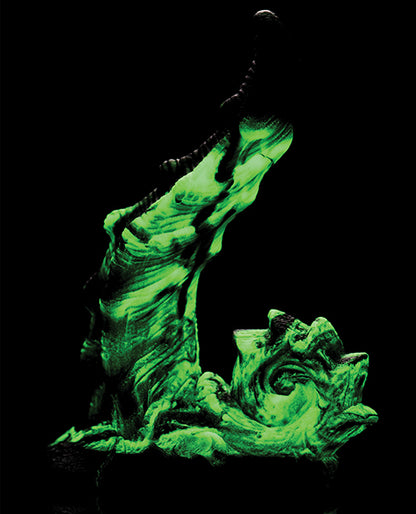 The Creature Cocks Glowzilla shown in the dark. All of the green, glow-in-the-dark color is very obvious with the lights out. | Kinkly Shop