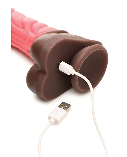 The charging cable is plugged into the base of the Creature Cocks Thrusting Centaur with Remote Control. The charging port is under the balls of the dildo. | Kinkly Shop