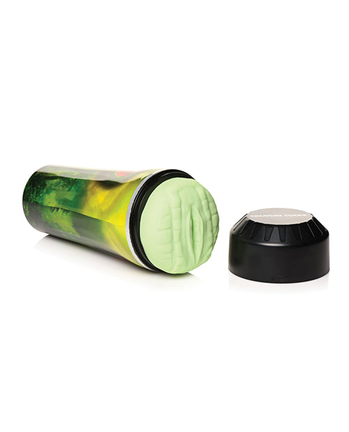 The Creature Cocks Raptor Stroker lays on its side with the black cap removed from the top of the stroker. This showcases the unique, 3D texture of the reptile orifice. | Kinkly Shop