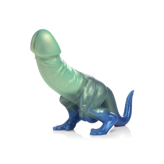 The Creature Cocks Jurassic Cock has a dinosaur-like feet and tail with a large penis shaft extending from the "dinosaur's" abdomen. | Kinkly Shop