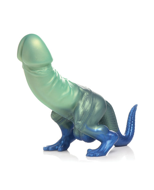 The Creature Cocks Jurassic Cock has a dinosaur-like feet and tail with a large penis shaft extending from the "dinosaur's" abdomen. | Kinkly Shop