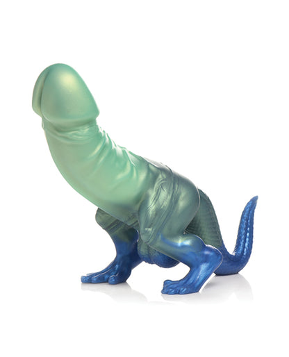 The Creature Cocks Jurassic Cock has a dinosaur-like feet and tail with a large penis shaft extending from the "dinosaur's" abdomen. | Kinkly Shop