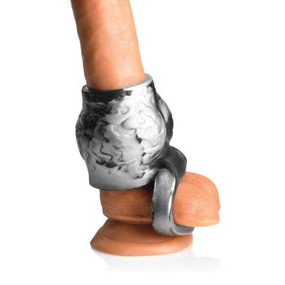 The Creature Cocks Night Prowler Sleeve being worn on a realistic dildo. It adds a lot of thickness to the base of the penis with a strap that anchors the knot around the testicles to keep it in place. | Kinkly SHop