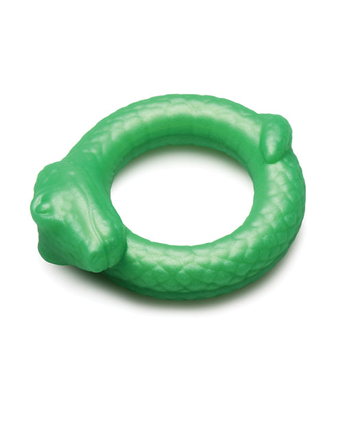 Close-up on the details of the Creature Cocks Serpentine including its serpent face and the little tail as well as the scaley details around the circle. | Kinkly Shop
