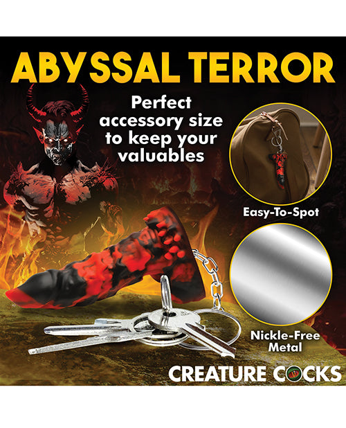 Collage shows the Creature Cocks Fire Demon Keychain hung from a bag. Text reads "Perfect accessory size to keep your valuables. Easy to spot. Nickel-free metal" | Kinkly Shop