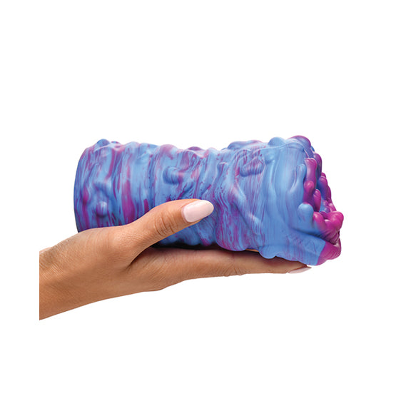 An outstretched palm has the Creature Cocks Cyclone Alien resting on top of it. The stroker is slightly longer than the person's outstretched palm. The stroker has light texturing on the outside of the stroker to make it easier to grip. | Kinkly Shop