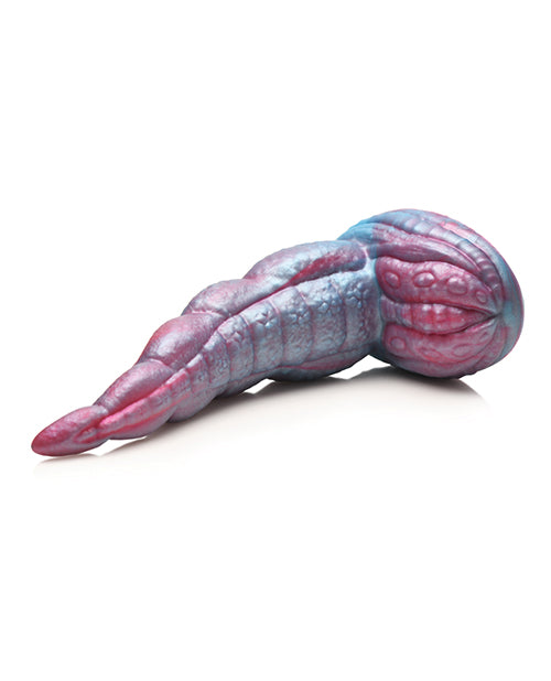 The Creature Cocks Tentacle lays on its side. The base and the shaft are very well-textured with scale-y like texturing. | Kinkly Shop