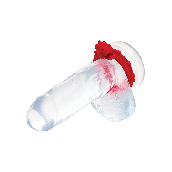 The Creature Cocks Rise of the Dragon shown wrapped underneath the testicles of a clear realistic dildo. It can be worn under the testicles or just at the base of the shaft. | Kinkly Shop