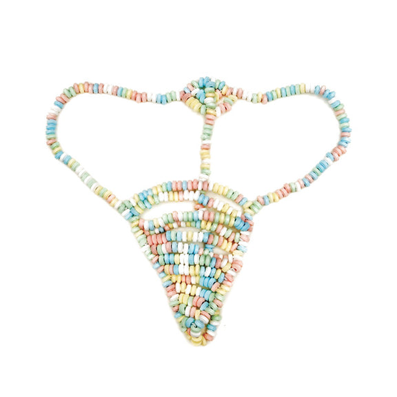 The Candy G-String panty laid flat against a white background. It is a g-string thong design with candies on every inch of the panty including the straps. | Kinkly Shop