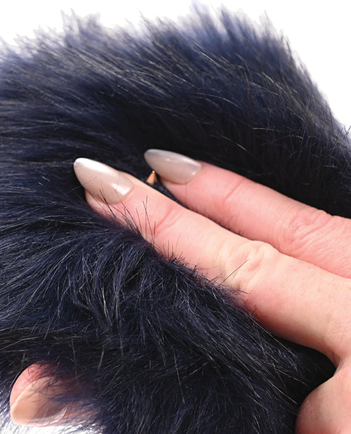 Two fingers push into the faux fur of the Sportsheets Cougar Spiked Sensory Glove, showcasing one of the hidden spikes that can be found within the Sportsheets Cougar Spiked Sensory Glove's surface. | Kinkly Shop
