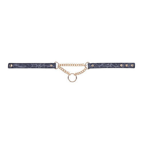 The Sportsheets Cougar Day Collar laid flat. The faux leather is on both sides of the chained center with the chained center and O-ring becoming the center of attention. | Kinkly Shop